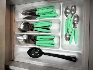 a drawer full of utensils in a refrigerator at Edifício Madrid | Ayrton Senna in Toledo