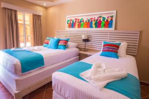 Una cama o camas en una habitación de Mr. Tucan Hotel