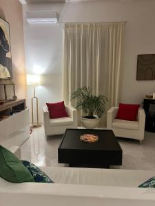 a living room with a couch and a coffee table at TIZIANA'S HOUSE in Salerno