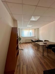 an office with tables and chairs in a room at APARTMÁN CENTRUM Palackého in Trenčín