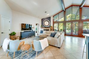 a living room with a couch and chairs at 4-Season Boathouse, Hot Tub! Guadalupe River Oasis in Seguin