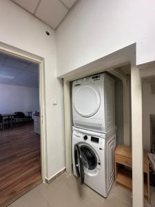 a washer and dryer in a room at APARTMÁN CENTRUM Palackého in Trenčín