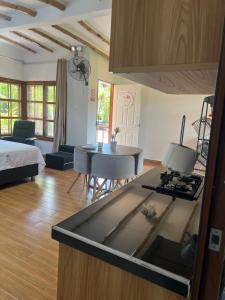 a kitchen with a stove top oven in a room at Jardín Secreto in San Martín