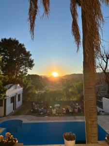 a view of the sunset from a villa at aromasdelpandeazucar in Unquillo