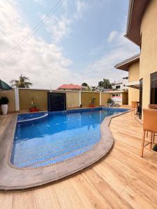 a swimming pool in the middle of a building at Sonia Hotel in Accra