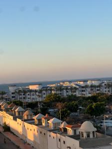 arial view of a city with houses and the ocean at Mazen Zakaria apartment in Port Said