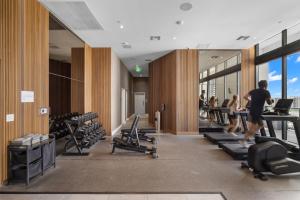 a gym with people exercising on treadmills at Vibras Wellness in Miami
