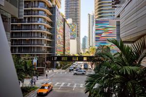 a street in a city with cars and buildings at Vibras Wellness in Miami
