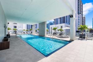a swimming pool on the roof of a building at Vibras Wellness in Miami