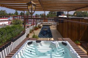 a hot tub on the deck of a cruise ship at Casa Hidalgo By Mi Querido Coyoacán in Mexico City