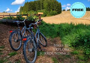 two bikes are parked next to a dirt road at WonderInn Riverside in Årnes