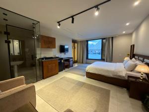 a bedroom with a large bed and a bathroom at Zahira Pyramids View in Cairo +37 photos