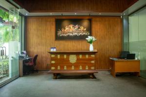 an office with a desk and a painting on the wall at Roy's Polonnaruwa in Polonnaruwa