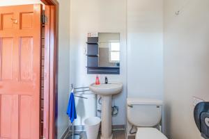 a bathroom with a white toilet and a sink at One Bus Stop to Time Square-4BR Duplex-Free Parking in Hillside +33 photos
