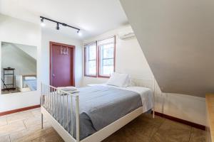 a bedroom with a bed and a window at One Bus Stop to Time Square-4BR Duplex-Free Parking in Hillside