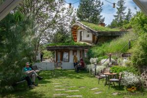 a group of people sitting outside of a house at Casa cu Suflet in Sighişoara
