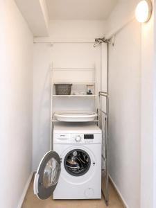 a washer and dryer in a small laundry room at Downtown View Apartment - Rhodes in Rhodes Town