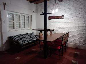 a living room with a table and a couch at Complejo el cordobes in Albardón