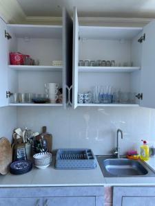 a kitchen with a sink and a counter top at Beka's GuestHouse in Gonio +16 photos