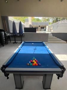 a pool table with balls on top of it at Alefhouse in Bauru