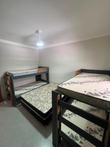 two bunk beds in a room with at Alefhouse in Bauru
