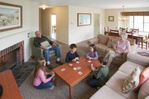 a group of children sitting in a living room at Brewster Green Resort in Brewster