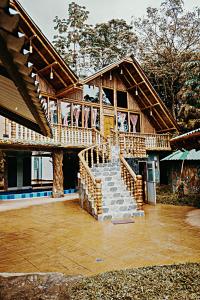 a house with a staircase in front of it at Boscaje Solarpunk Habitat in La Gran Via