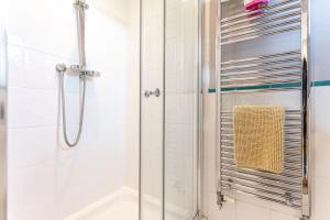 a bathroom with a shower and a tub at Links Lodge - Blacklaws Steading in Anstruther +40 photos