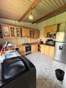 a kitchen with a washer in the middle of it at Cabaña de campo privada con piscina in Casa Blanca Hacienda