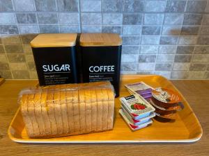a tray with a sandwich and a cup of coffee at Elia House in Skopelos Town