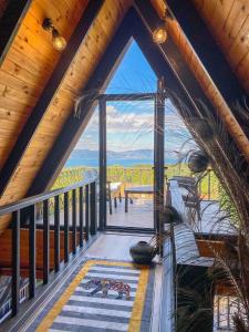 a room with a large window in a log cabin at Dilek Alagöz in Sapanca