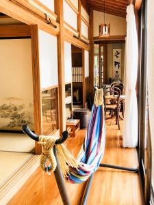 a hammock is hanging in a living room at STAY FUJI a in Yamanakako
