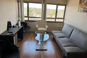 a living room with a couch and a table at Departamento en Calama in Calama