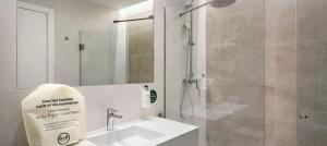 a bathroom with a shower and a sink and a shower at B&B HOTEL Murcia Thader in Churra