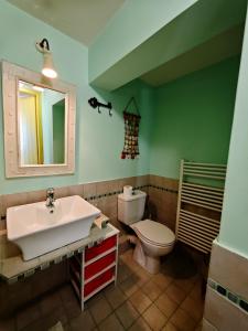 a bathroom with a sink and a toilet at MONI apartment in Perdika +11 photos