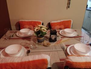 a dining room table with plates and dishes on it at Shore residences tower D in Manila