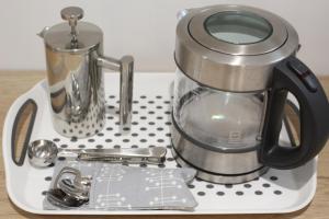 a tray with a coffee pot and a cup on it at Collis Annexe in Didcot