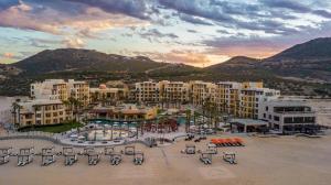 an aerial view of a resort with a parking lot at Pueblo Bonito Pacifica Golf & Spa Resort - All Inclusive - Adults Only in Cabo San Lucas