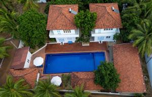 an aerial view of a house with a swimming pool at Blue Kite Retreat in Kalpitiya +50 photos