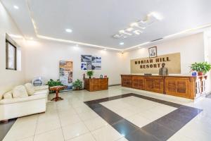 a lobby with a waiting room with a reception desk at Moriah Hill Resort in Kibuye