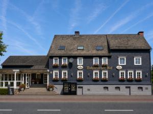 a building on the side of a street at Dahlbrucher Hof in Hilchenbach