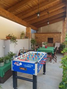 a foosball table in the middle of a patio at Mirtillo & Margot in Cambiano