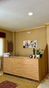 a reception desk in a room with at Pension As Termas in Bubaces