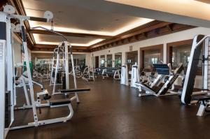 a gym with treadmills and elliptical machines at Pueblo Bonito Sunset Beach Golf & Spa Resort - All Inclusive in Cabo San Lucas