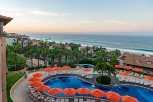 an aerial view of a resort with a swimming pool and the ocean at Pueblo Bonito Sunset Beach Golf & Spa Resort - All Inclusive in Cabo San Lucas