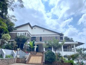 a white house with a white fence at Ilemi Gardens in Nairobi