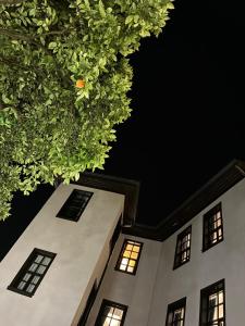 a view of a building at night at Morea Kaleiçi-Adults Only in Antalya