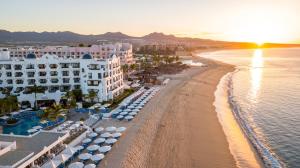 an aerial view of a beach with buildings and umbrellas at Pueblo Bonito Rose Resort & Spa - All Inclusive in Cabo San Lucas