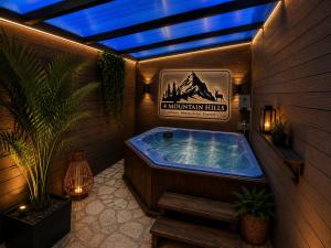 a jacuzzi tub in a room with a sign at 4 MOUNTAIN HILLS in Megalo Chorio
