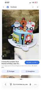 a birthday cake with a fire truck and ambulance at Saro in Lourdes